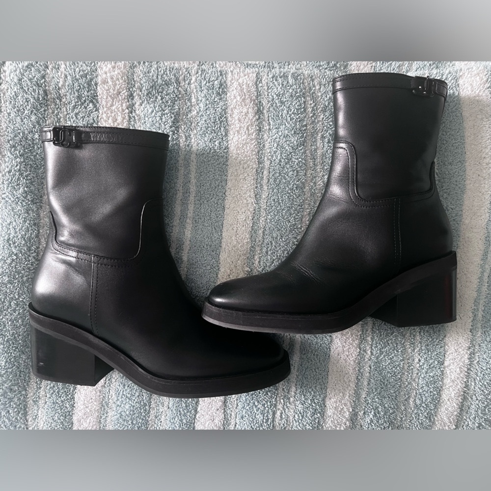 Jimmy Choo Black Heeled Boots Sleek Leather Design